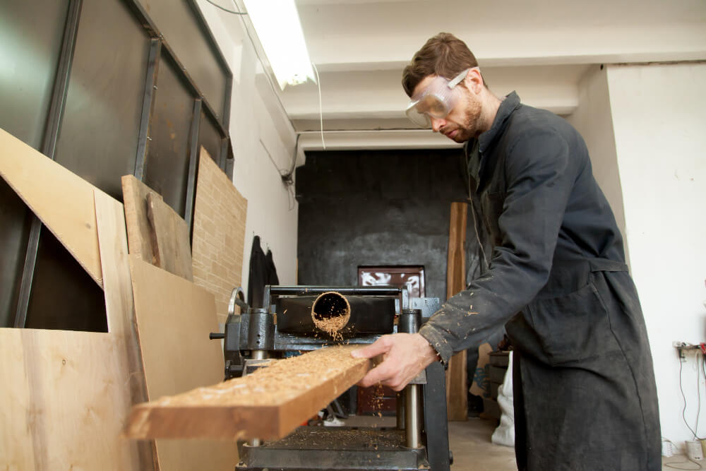 a millworker crafting a cabinet